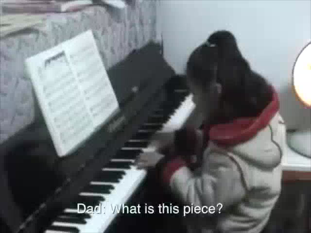 Linda as a child practising the piano